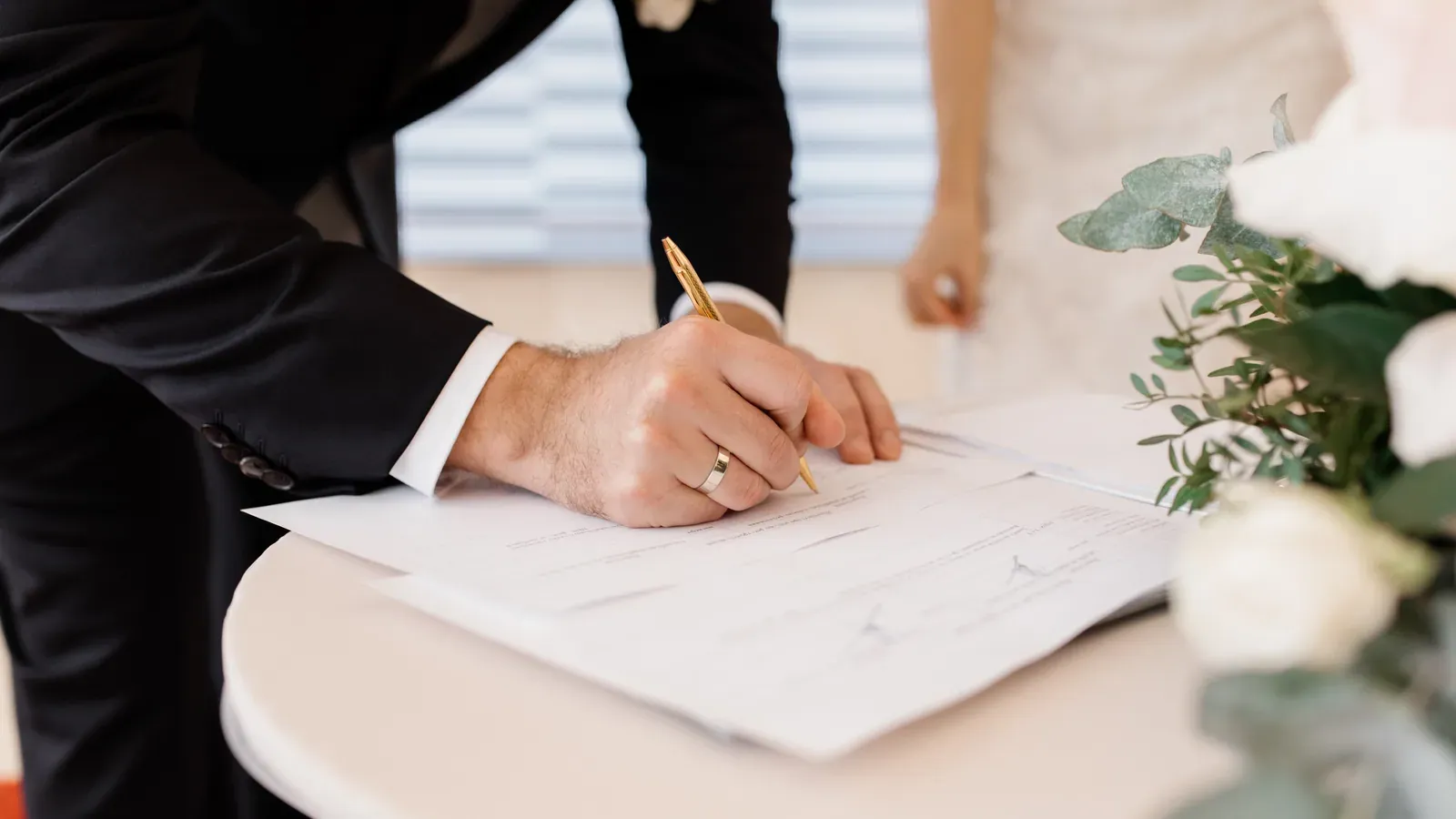 A couple signing a domestic contract under Ontario family law