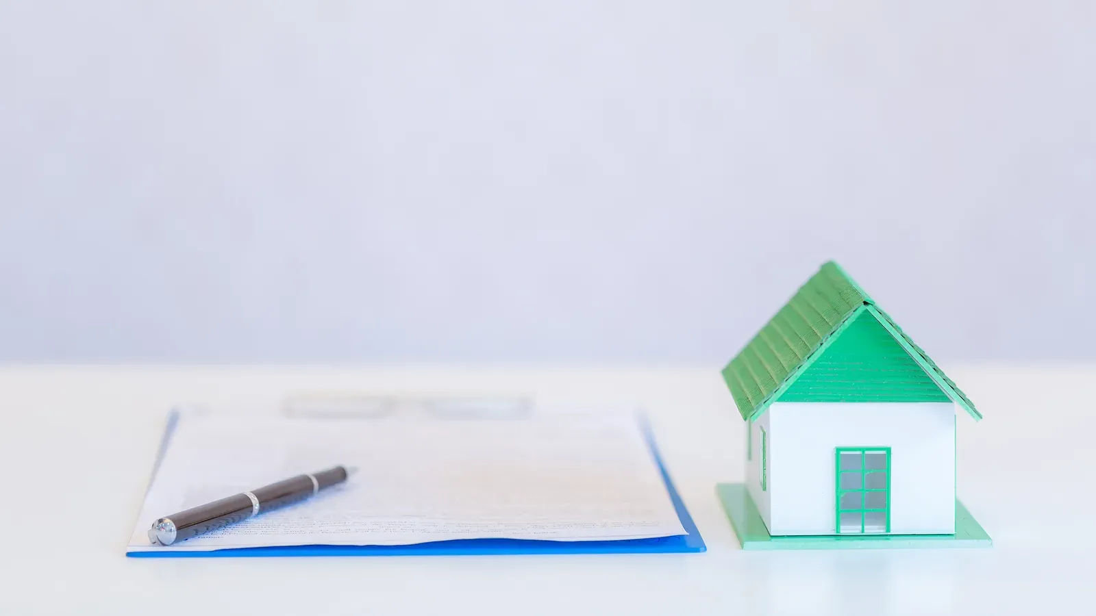 House and financial documents representing matrimonial property equalization